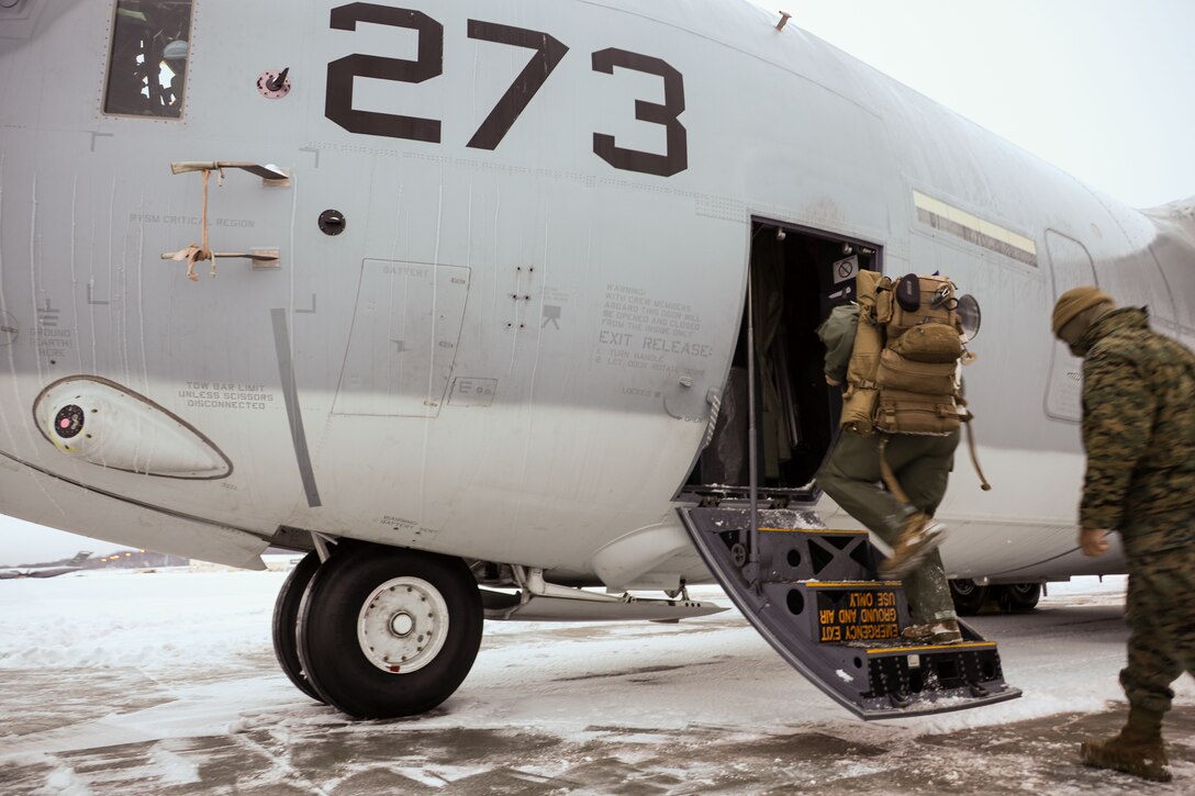 U.S. Marines with Marine Aerial Refueler Transport Squadron (VMGR) 153, Marine Aircraft Group 24, 1st Marine Aircraft Wing board a KC-130J Hercules in Anchorage, Alaska, Dec. 11, 2023. VMGR-153 conducted combat assault transport and air delivery in support of Alaska Marines’ Toys for Tots mission which enhanced combat readiness and supported community relations in remote Alaskan villages. (U.S. Marine Corps photo by Staff Sgt. Olivia Ortiz)