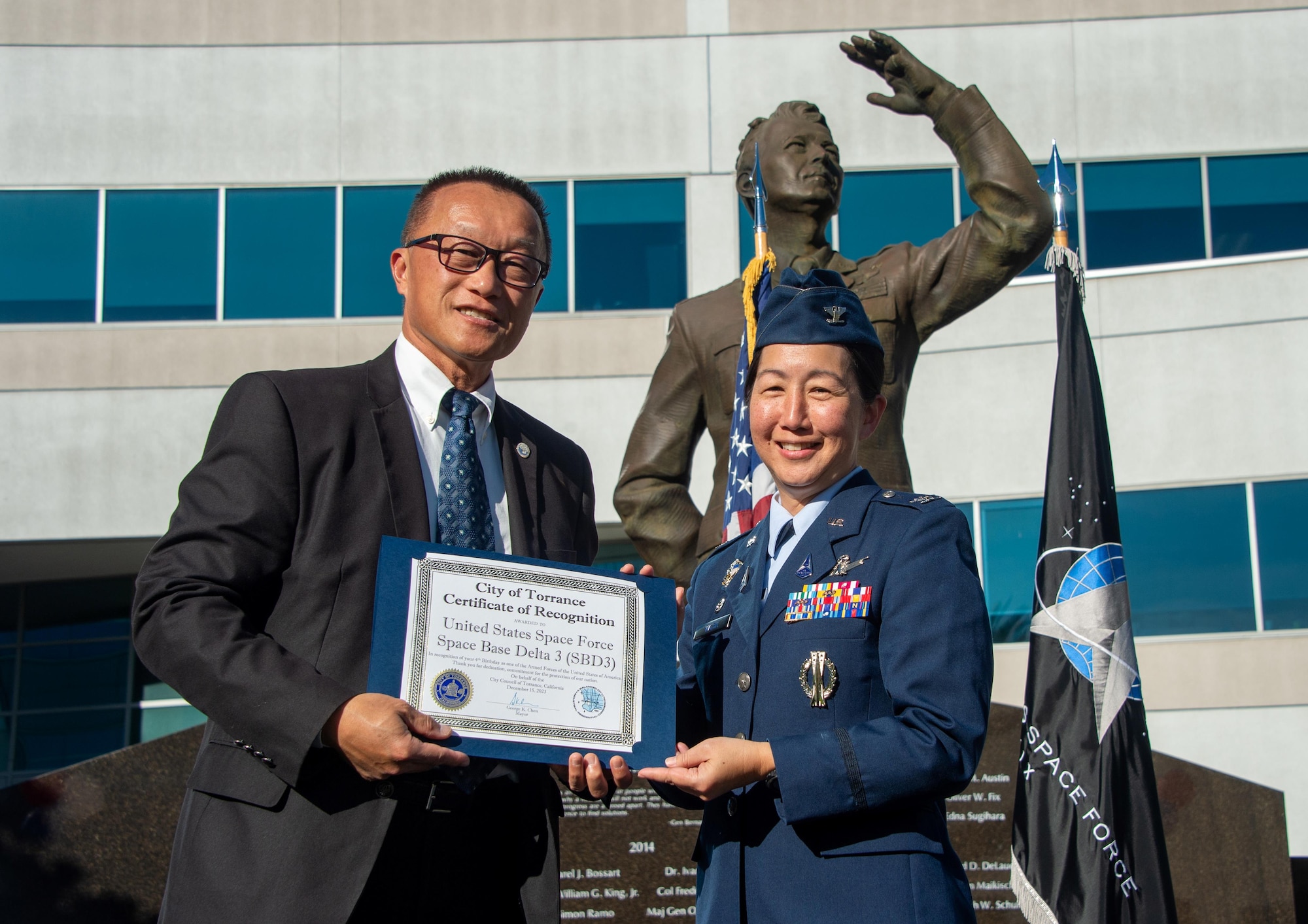 Col. Mia L. Walsh, Space Base Delta 3 Commander, receives a certificate of recognition from Mayor George K. Chen, City of Torrance, to celebrate the USSF’s fourth birthday in the Schriever Courtyard, Los Angeles Air Force Base, Calif., Dec. 15, 2023. (USSF photo by Van De Ha).