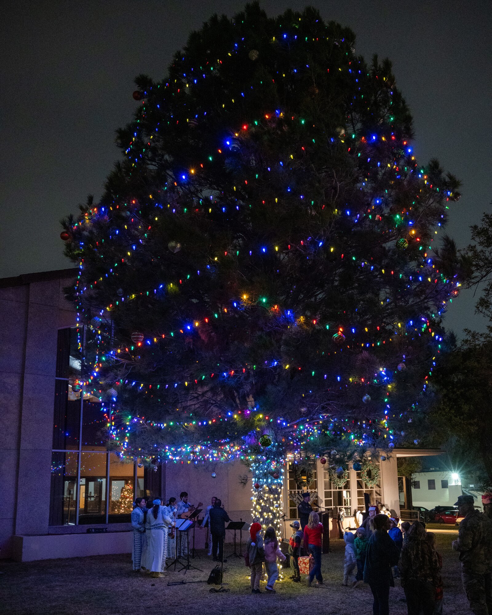 The tree is lit at the chapel after the ceremony at Laughlin Air Force Base, Texas, Nov. 29, 2023. The ceremony brought many families out to join in holiday festivities and celebrate the holiday season. (U.S. Air Force photo by Staff Sgt. Nicholas Larsen)