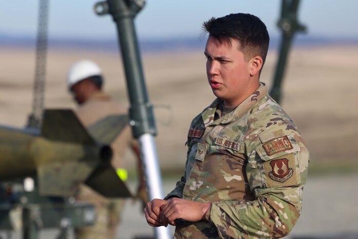 U.S. Air Force Senior Airman Marshall Lonetree-Burgess, 649th Munitions Squadron munition inspector from Hill Air Force Base, Utah, manages operations during the Air Force Combat Ammunition Course (AFCOMAC), Dec. 13, 2023, on Beale Air Force Base, California.