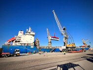 Precast concrete foundations are loaded onto the Military Sealift Command chartered ship MV Ocean Gladiator as part of the Operation Deep Freeze 2024 cargo loadout.  Cargo operations are being coordinated by MSC's Expeditionary Port Unit 114 in Port Hueneme Calif.
