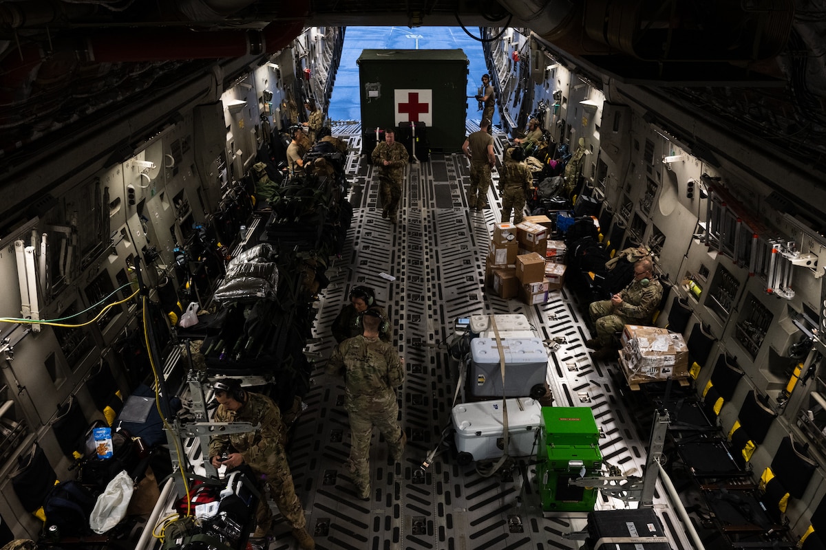 Image of Airmen on an aircraft.