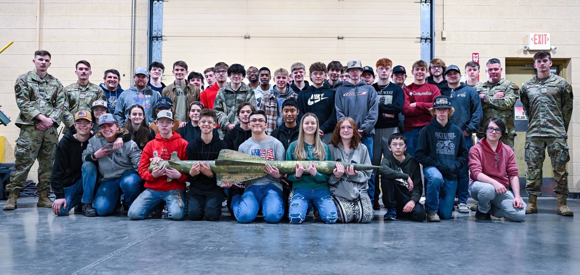 Students and faculty from Douglas High School pose with members from the 28th Maintenance Squadron Fabrication Flight at Ellsworth Air Force Base, South Dakota, Dec. 12, 2023.