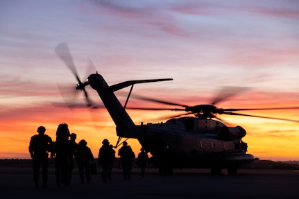 U.S. Marines with I Marine Expeditionary Force board a CH-53E Super Stallion assigned to Marine Heavy Helicopter Squadron (HMH) 361, Marine Aircraft Group 16, 3rd Marine Aircraft Wing, during a Marine Corps Combat Readiness Evaluation (MCCRE) in support of Exercise Steel Knight 23.2 at Marine Corps Air Station Miramar, California, Dec. 2, 2023. The MCCRE is conducted before deployment, consisting of a tactical recovery of aircraft and personnel exercise, high altitude aerial refueling, aviation delivered ground refueling, external lift exercises. Steel Knight 23.2 is a three-phase exercise designed to train I Marine Expeditionary Force in the planning, deployment and command and control of a joint force against a peer or near-peer maneuver capabilities of the Marine Air-Ground Task Force. (U.S. Marine Corps photo by Lance Cpl. Jackson Rush)