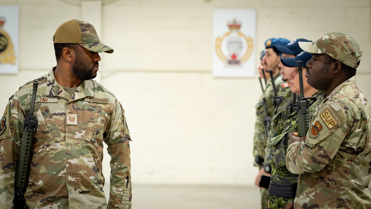 Canadian Armed Forces and United States Air Force students of the Primary Leadership Qualification Course 2305 come together for a graduation on December 13, 2023, at 16 Wing/Canadian Forces Base Borden, Ontario, to receive their Military Certificates of Achievement.