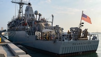 MANAMA, Bahrain (Dec. 17, 2023) Personnel aboard the U.S. Navy Avenger-class mine countermeasures ship USS Devastator (MCM 6) make preparations to depart Naval Support Activity (NSA) Bahrain for sea trials, Dec. 17. NSA Bahrain enables the forward operations and responsiveness of U.S. and allied forces in support of Navy Region Europe, Africa, Southwest Asia's mission to provide services to the fleet, warfighter and family. (U.S. Navy photo by Mass Communication Specialist 2nd Class MacAdam Kane Weissman)