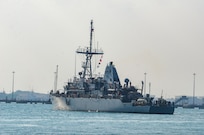 MANAMA, Bahrain (Dec. 17, 2023) U.S. Navy Avenger-class mine countermeasures ship USS Devastator (MCM 6) departs Naval Support Activity (NSA) Bahrain for sea trials, Dec. 17. NSA Bahrain enables the forward operations and responsiveness of U.S. and allied forces in support of Navy Region Europe, Africa, Southwest Asia's mission to provide services to the fleet, warfighter and family. (U.S. Navy photo by Mass Communication Specialist 2nd Class MacAdam Kane Weissman)