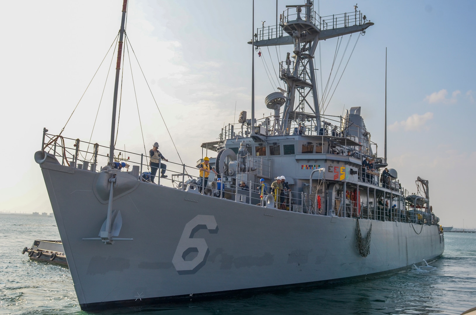 MANAMA, Bahrain (Dec. 17, 2023) U.S. Navy Avenger-class mine countermeasures ship USS Devastator (MCM 6) departs Naval Support Activity (NSA) Bahrain for sea trials, Dec. 17. NSA Bahrain enables the forward operations and responsiveness of U.S. and allied forces in support of Navy Region Europe, Africa, Southwest Asia's mission to provide services to the fleet, warfighter and family. (U.S. Navy photo by Mass Communication Specialist 2nd Class MacAdam Kane Weissman)