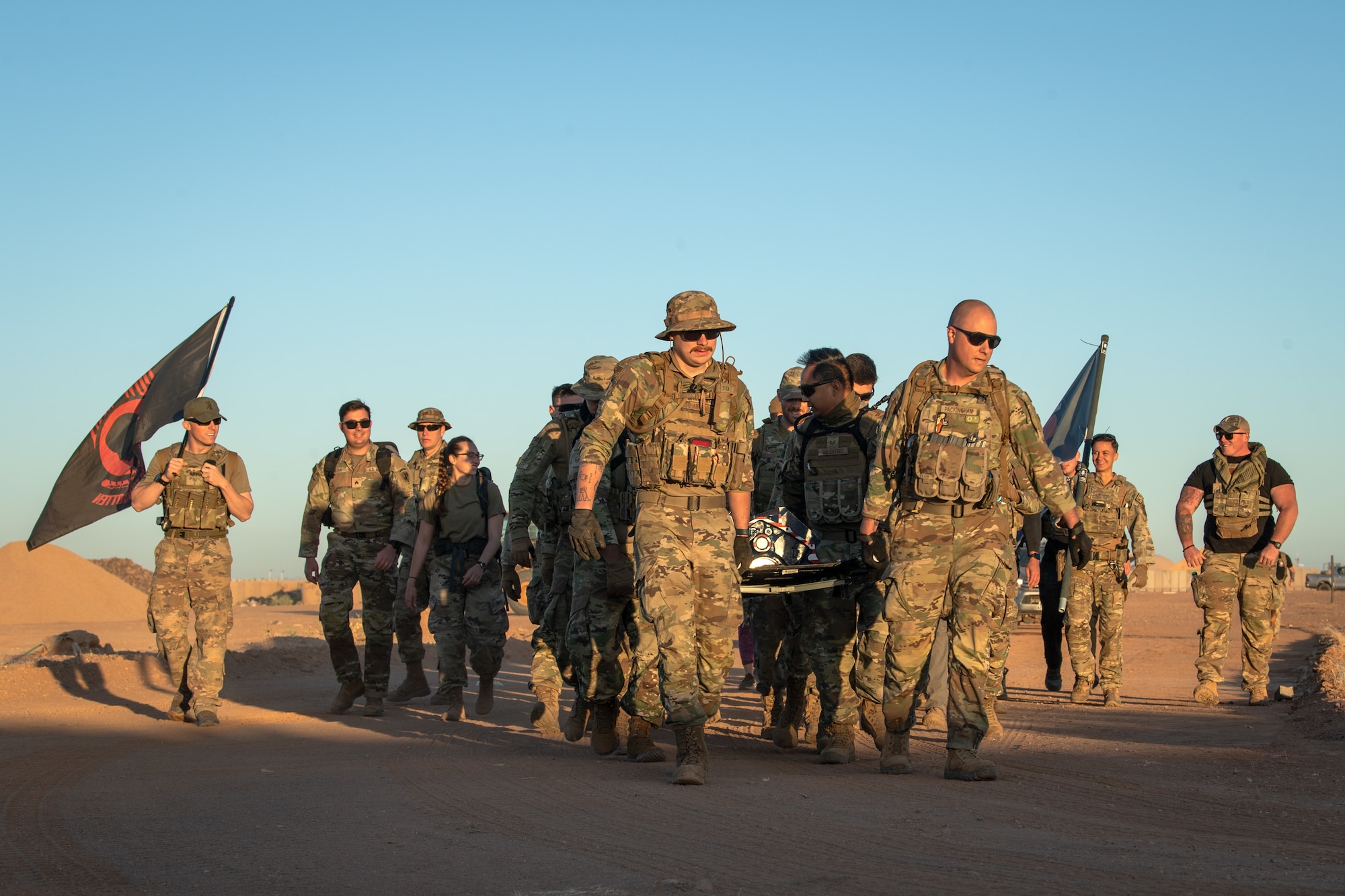 U.S. Airmen participate in memorial ruck march.