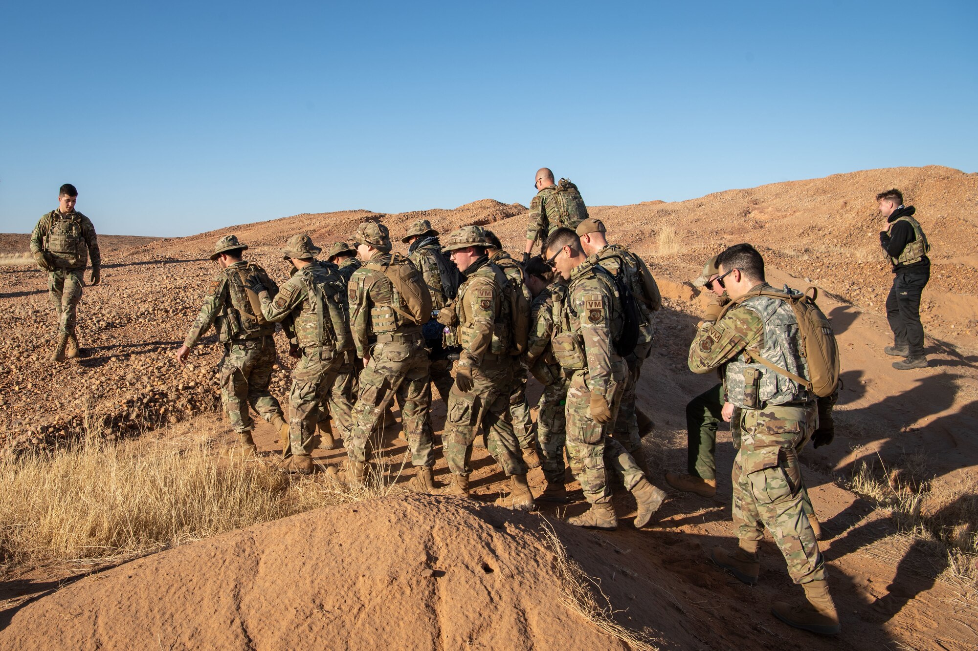 U.S. Airmen participate in memorial ruck march.