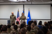 A photo of leadership briefing Airmen.