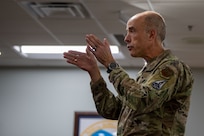 A photo of leadership briefing Airmen.