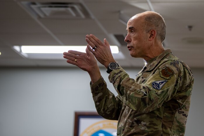 A photo of leadership briefing Airmen.