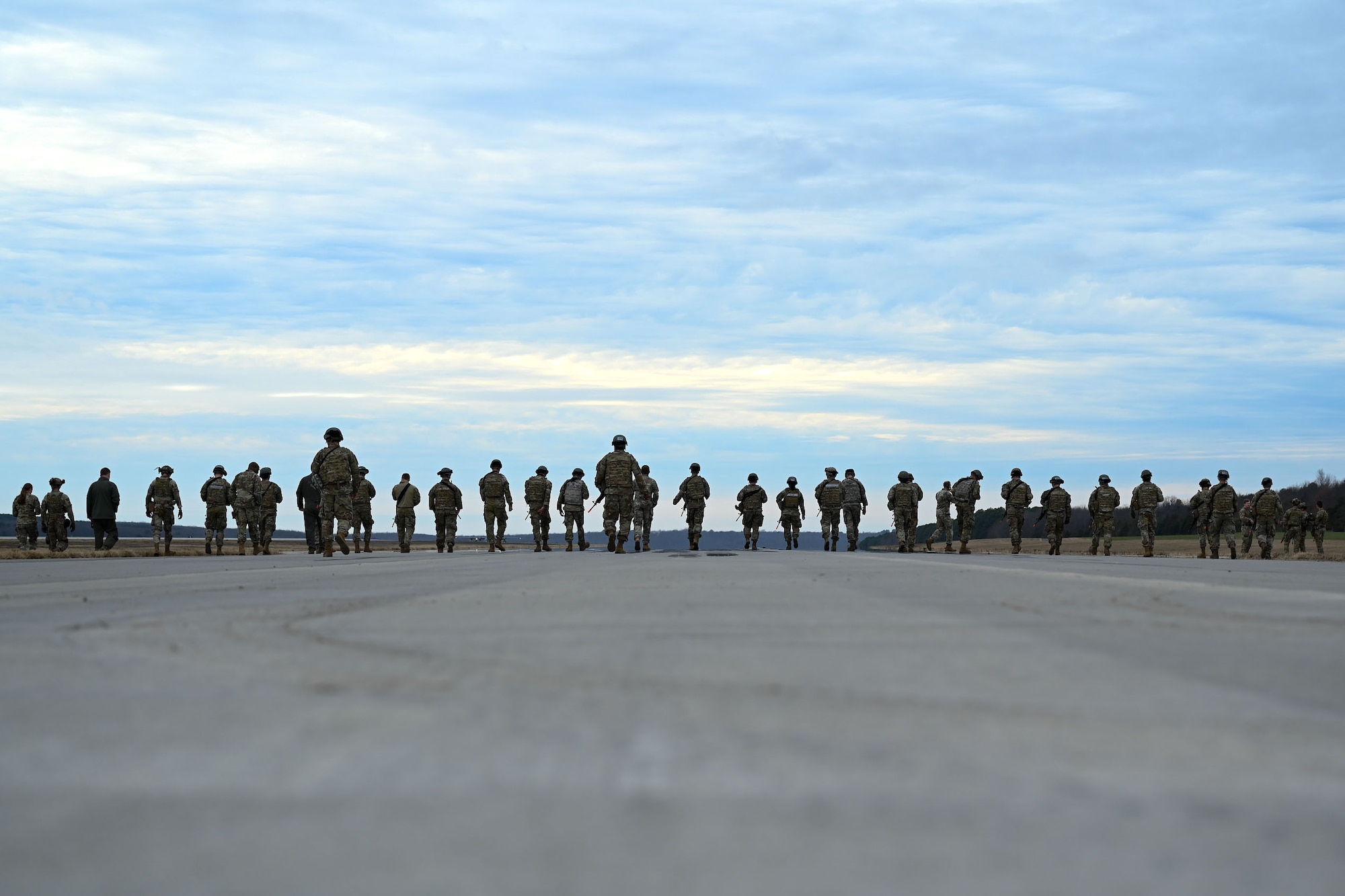 Team Little Rock Airmen walk the flightline during a Warrior Airmen Readiness Center capstone event