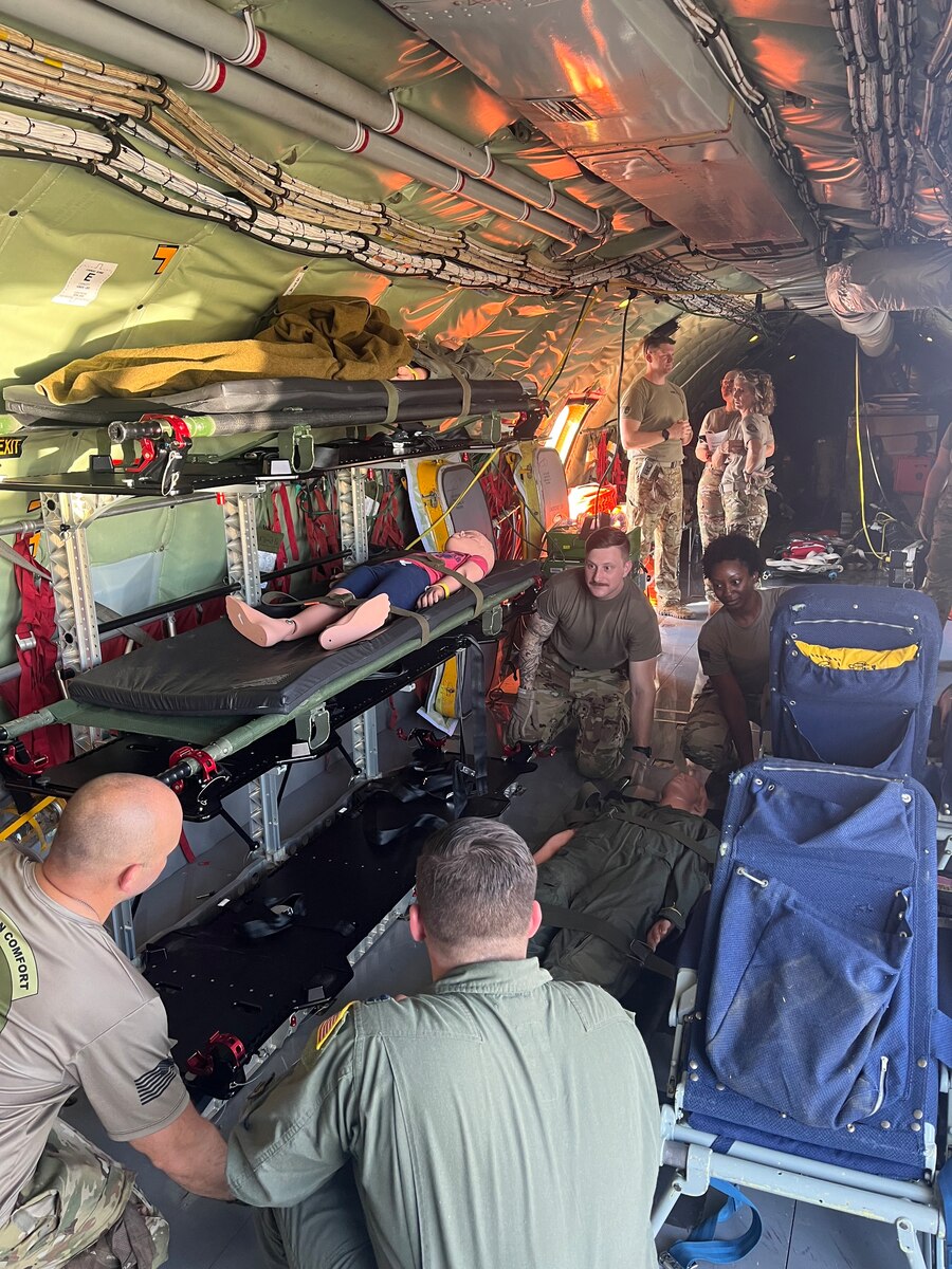 people prep an aircraft for training
