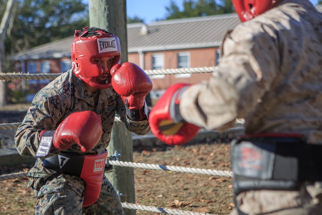 U.S. Marine Corps Sgt. Holloway, an artillery systems technician with 1st Battalion, 10th Marine Regiment, 2nd Marine Division, spars with an opponent during a Martial Arts Instructor Course (MAIC) hosted by 3rd Marine Raider Battalion at Stone Bay, Marine Corps Base Camp Lejeune, North Carolina, Dec. 7, 2023. The Martial Arts Instructor Course is a three-week course that creates knowledgeable and proficient Marine Corps Martial Arts Program instructors. (U.S. Marine Corps photo by Lance Cpl. Daniela Chicas Torres)