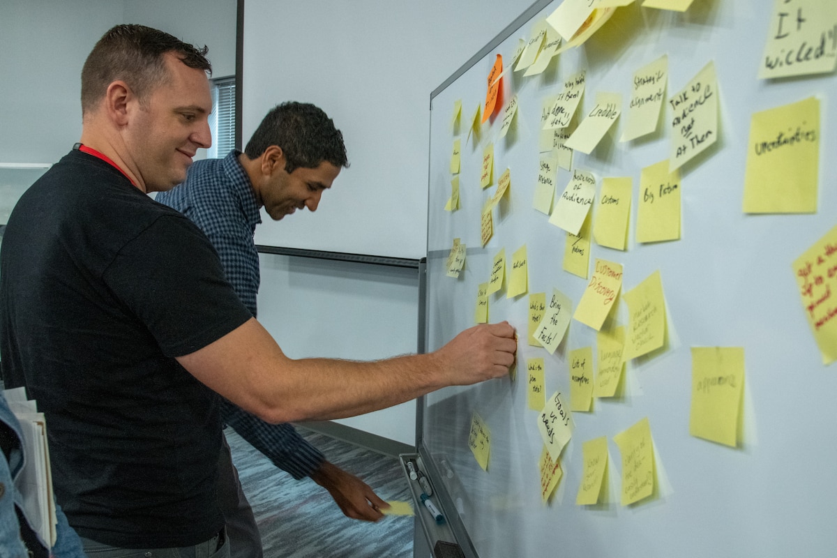 Anthony "Wedge" Bunker of AFWERX, left, and Shreyas Balaram AFIMSC work with key influencers from AFWERX, SAF/MG, SAF/SSG, AFIMSC, Morpheus, AF Futures and others to develop a cohesive Pitch Coaching curriculum that will be used to help Airmen innovators at every level effectively tell their story. (U.S. Air Force photo by Jennifer Bryant)