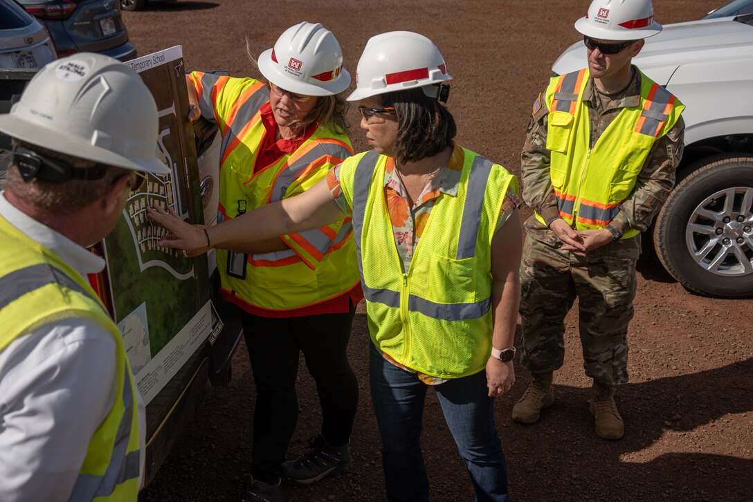 U.S. Army Corps of Engineers Critical Public Facilities Mission Manager Kara Vick speaks with U.S. Rep. Jill Tokuda during a visit to the temporary replacement campus for King Kamehameha III Elementary School, Dec. 16, 2023 in Lahaina, Hawaii.