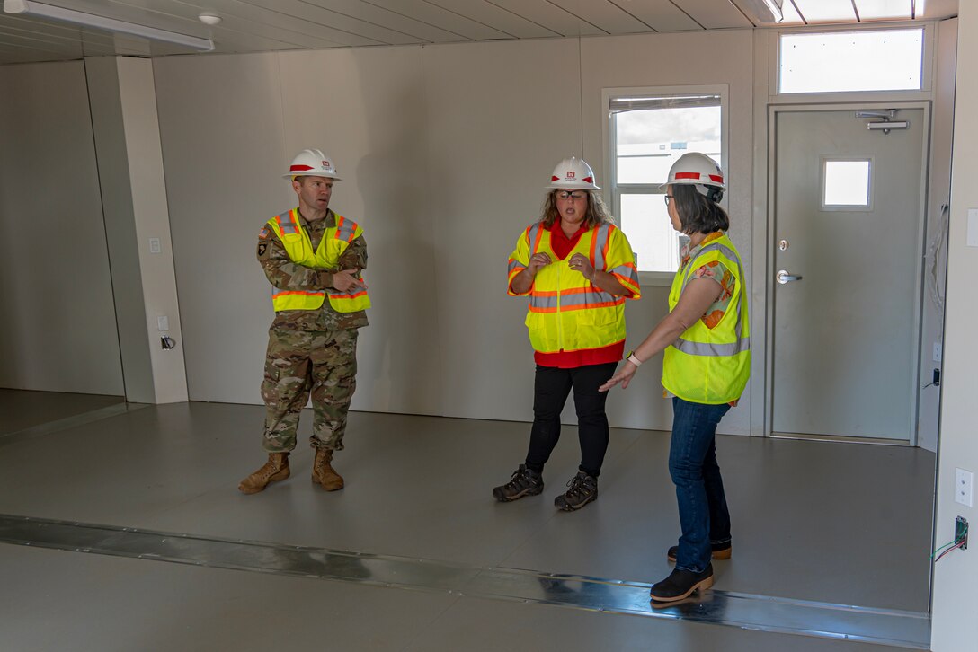 U.S. Army Corps of Engineers Critical Public Facilities Mission Manager Kara Vick and Recovery Field Office Commander Col. Jess Curry speak with U.S. Rep. Jill Tokuda during a visit to the temporary replacement campus for King Kamehameha III Elementary School, Dec. 16, 2023 in Lahaina, Hawaii.
