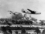 Black and white photo of B-24's