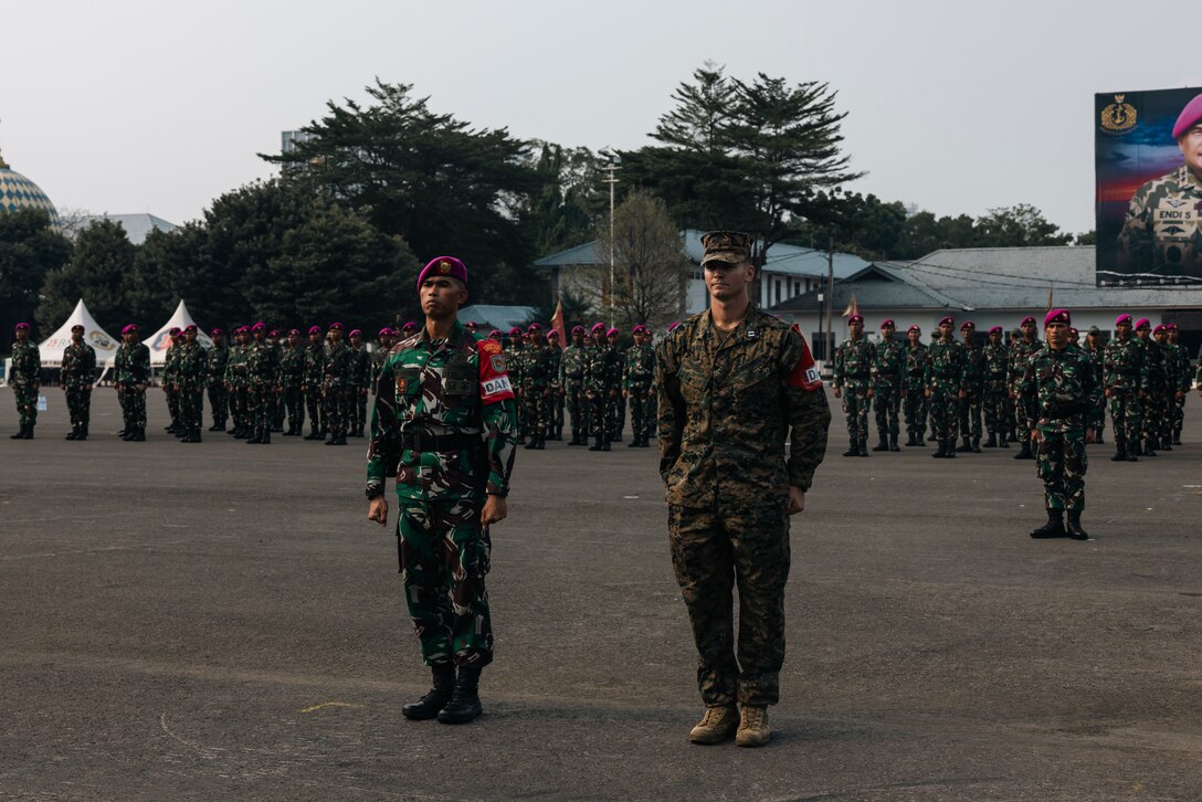 An Indonesian marine, left, and U.S. Marine Corps Capt. Phillip Badrov, the maritime sensing team officer in charge for Marine Rotational Force-Southeast Asia, participate in the Keris Marine Exercise 2023 closing ceremony on Cilandak Marine Base, Jakarta, West Java, Indonesia, Dec. 11, 2023. Keris MAREX is a bilateral exercise led by the U.S. Marine Corps and Indonesia Marine Corps to promote military interoperability and maritime domain awareness capabilities, strengthen relationships, and expand military capabilities among participating forces. MRF-SEA is a Marine Corps Forces Pacific operational model that involves exchanges with subject matter experts, promotes security goals with Allies and partners, and positions I MEF forces west of the International Date Line. (U.S. Marine Corps photo by Sgt. Shaina Jupiter)