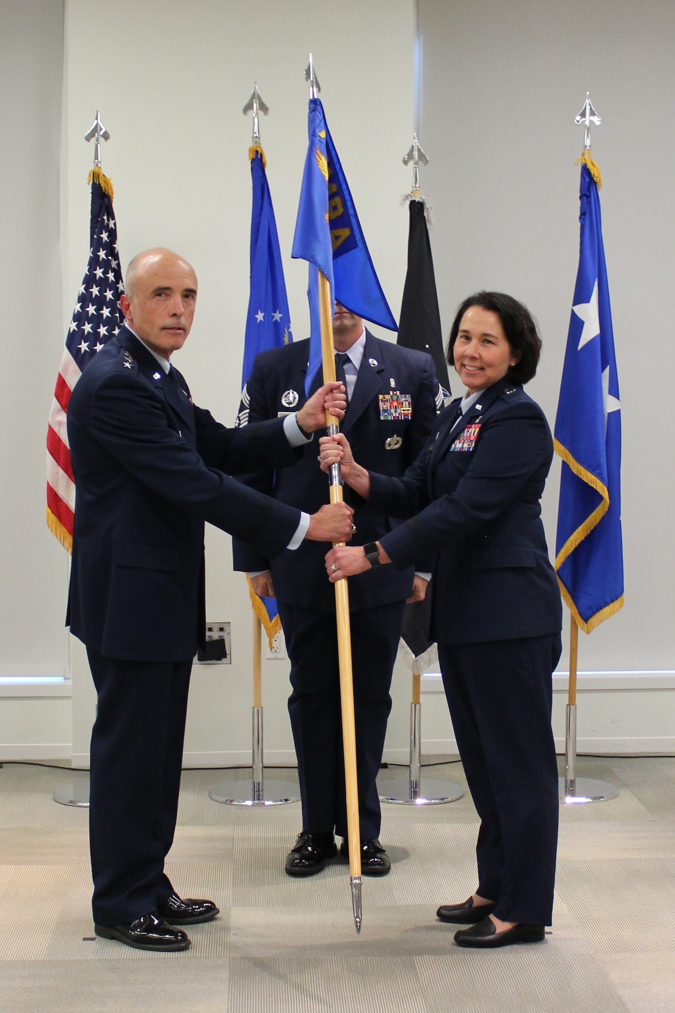 Image of two Airmen posing for a photo.