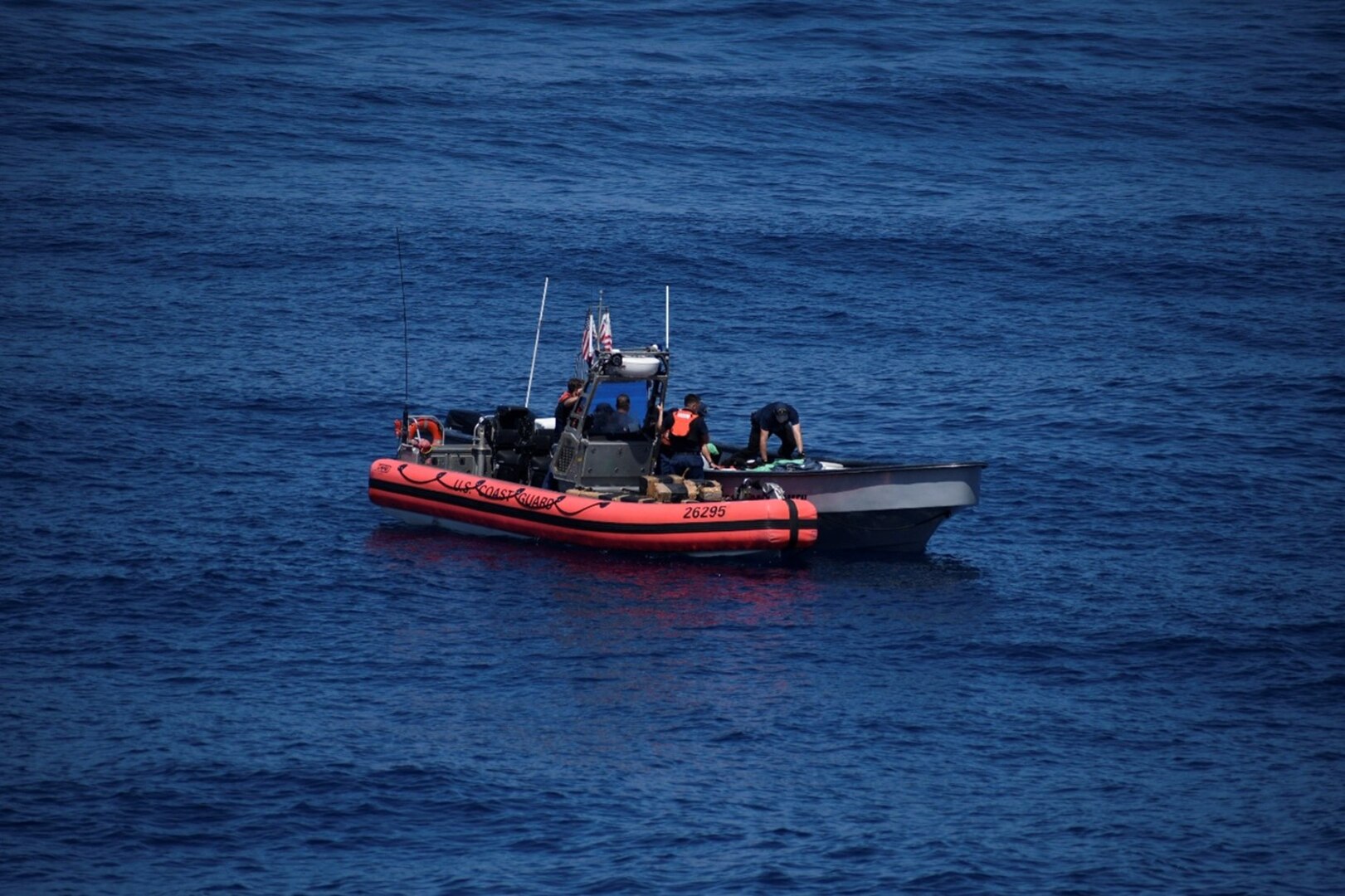U.S. Coast Guard Cutter Active crew conduct a boarding of a vessel suspected of illicit maritime activity in the Eastern Pacific Ocean, Nov. 23, 2023. The crew successfully interdicted over 3,400 pounds of cocaine and detained three suspected narcotics traffickers. (U.S. Coast Guard photo by Chief Petty Officer Shane Sexton)