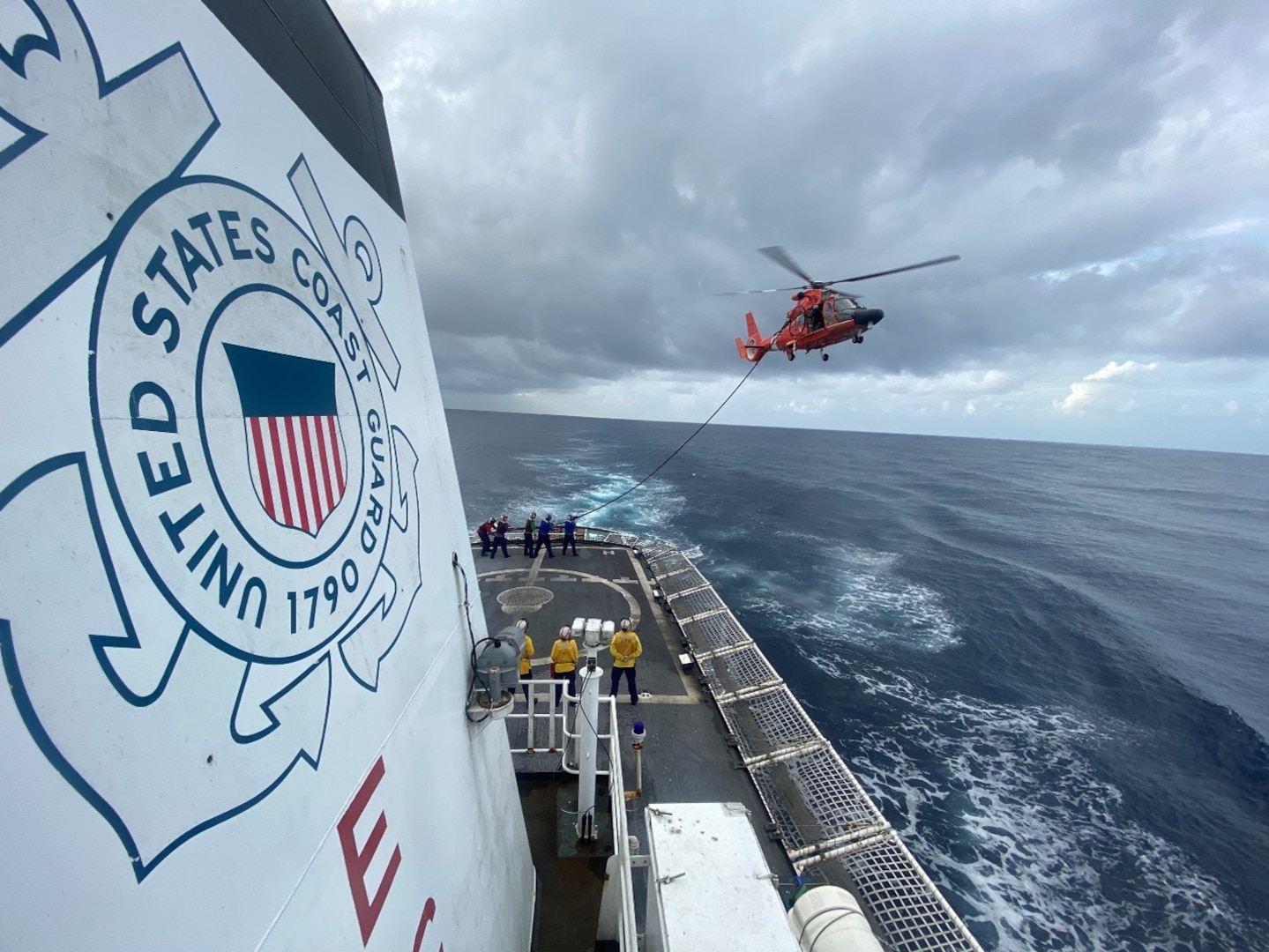 U.S. Coast Guard Cutter Active and crew conduct a helicopter in-flight refueling evolution with a Florida-based MH-65 Dolphin helicopter aircrew from Helicopter Interdiction Tactical Squadron in the Eastern Pacific Ocean, Nov. 28, 2023. Active and crew routinely deploys to this region in effort to disrupt transnational criminal organizations specifically in pursuit of illegal trafficking of narcotics. Equipped with two boats and an MH-65E helicopter from Helicopter Interdiction Tactical Squadron (HITRON), Active and crew met a variety of mission demands. (U.S. Coast Guard photo Cmdr. Mike Mastrianni)