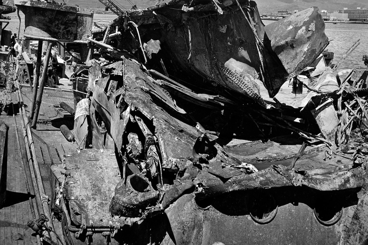 Mangled metal is all that’s left of a large ship.