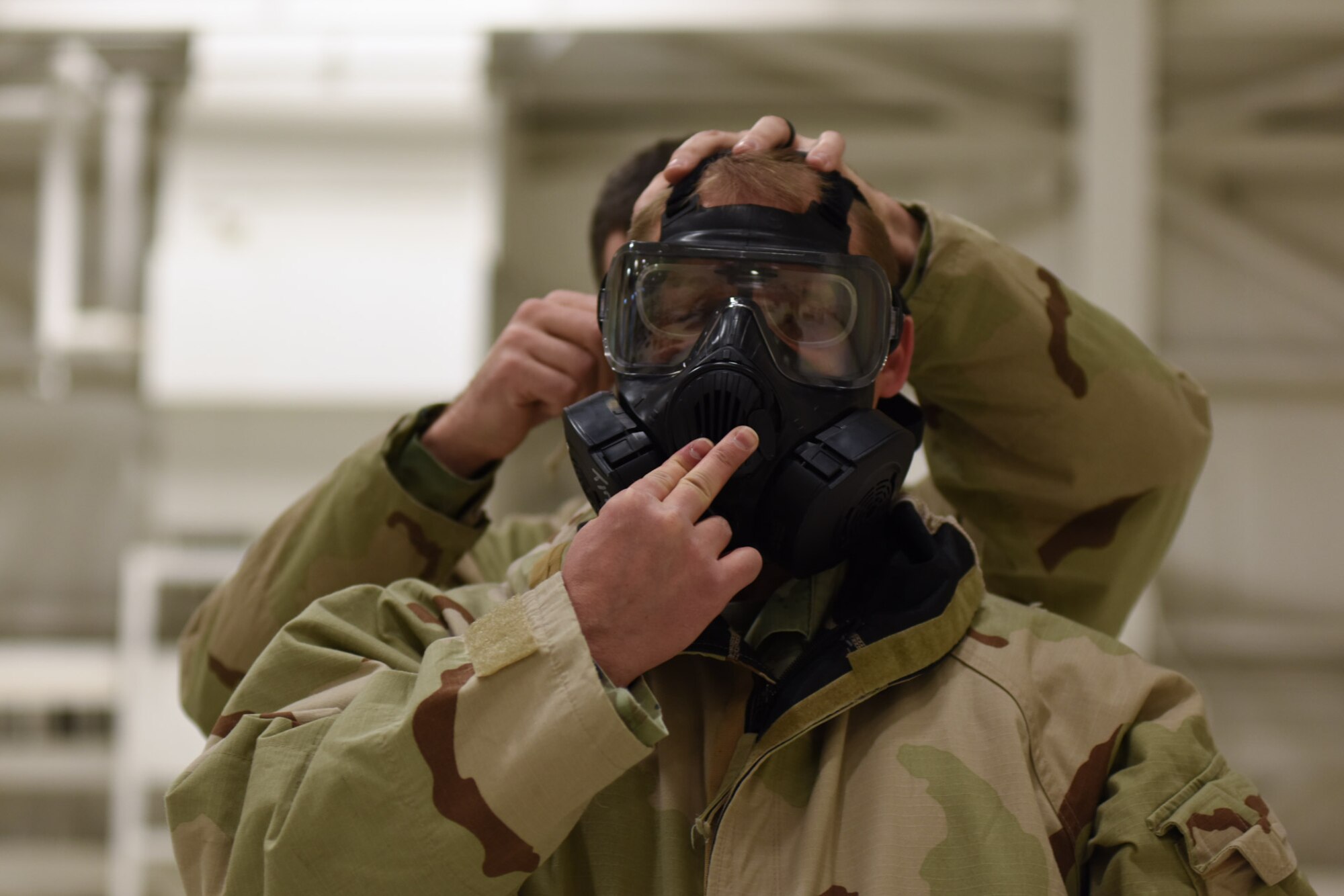 Airmen take the CBRN training course.