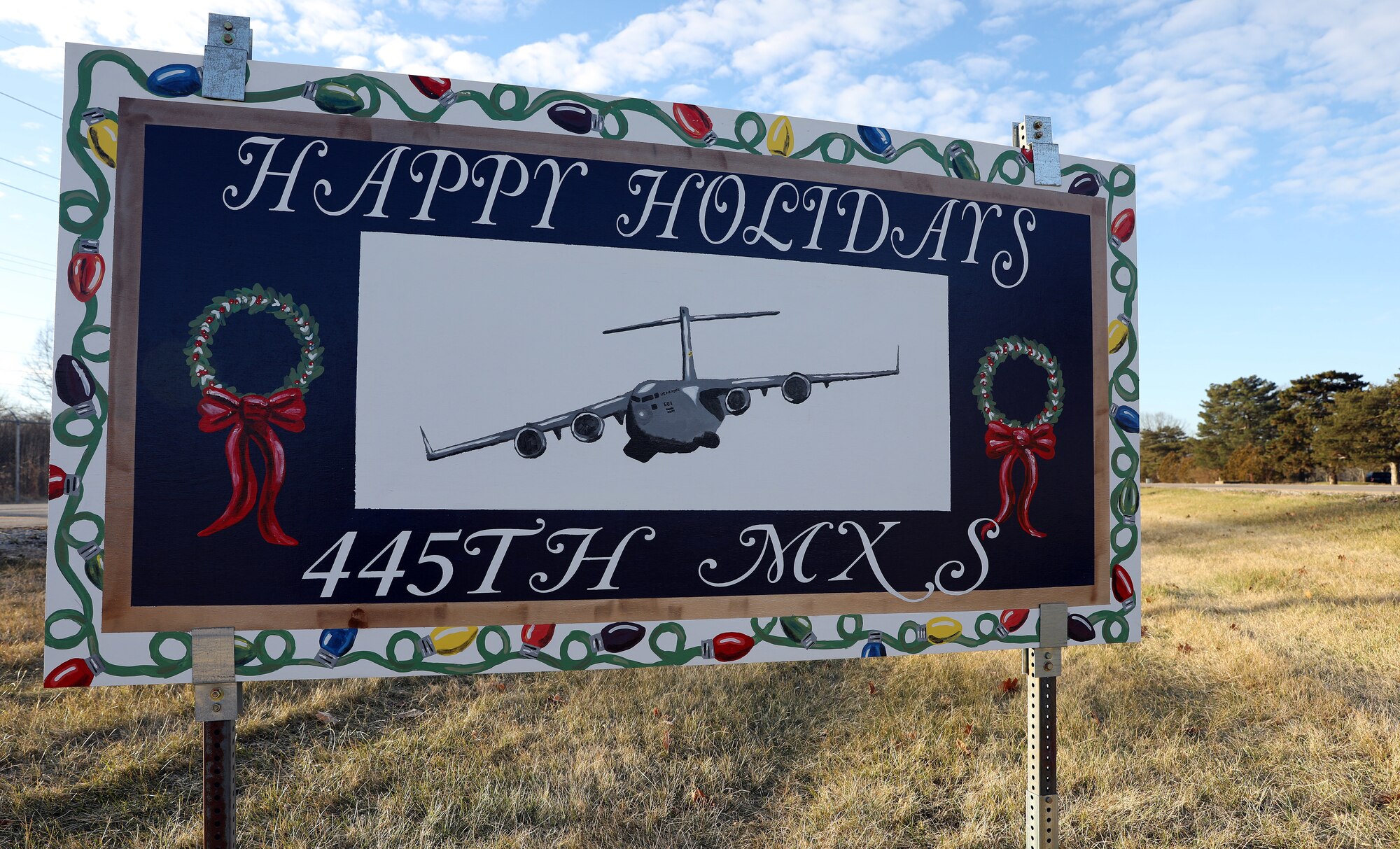 The 445th Maintenance Squadron celebrates the holidays with a six-foot greeting card for the base card display. Various units participated with cards that represent their mission. (U.S. Air Force photo by Amanda Dick)