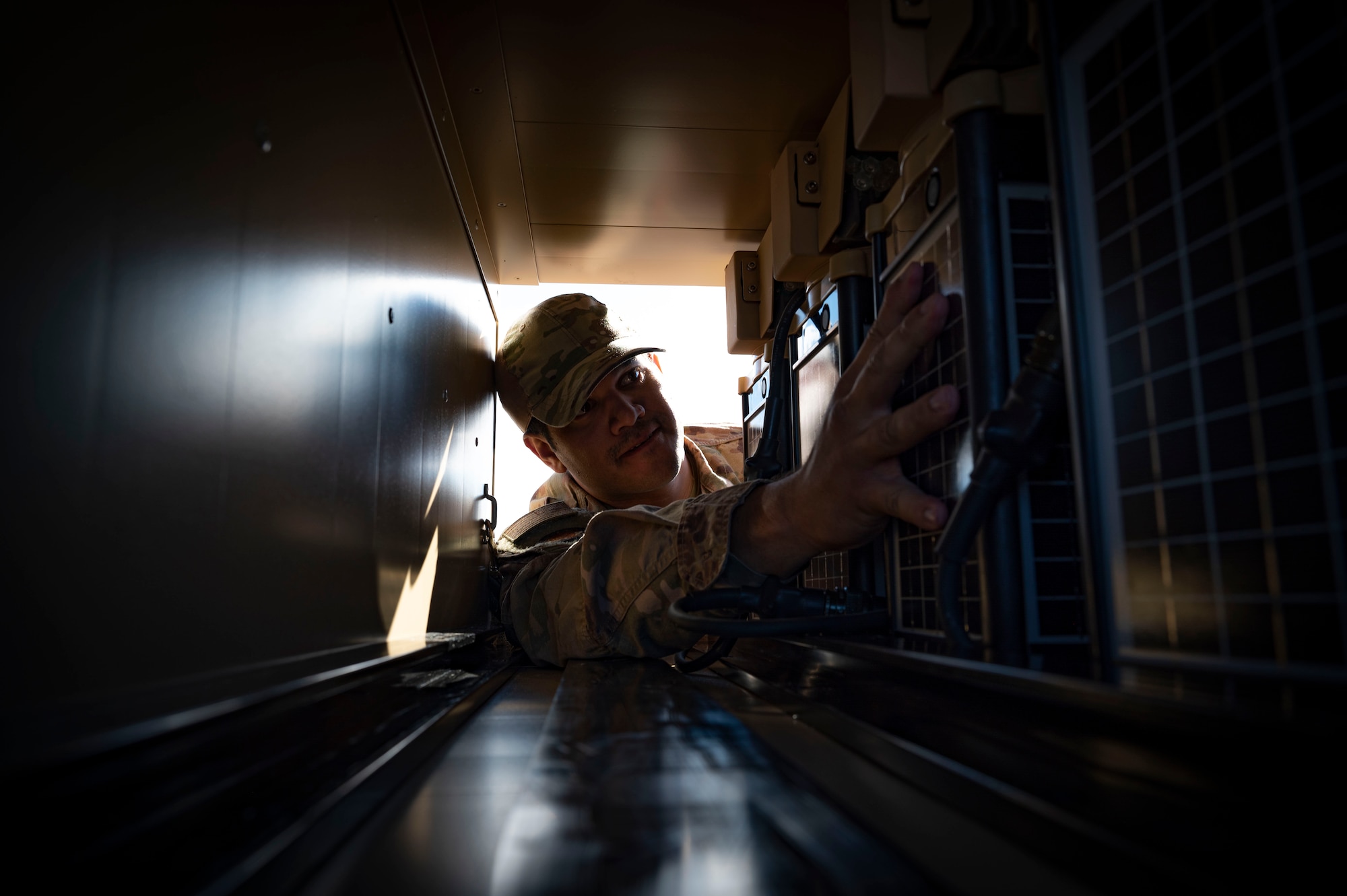 U.S. Air Force Staff Sgt. Daniel Santiago, 1st Special Operations Civil Engineer Squadron electrician, stores a group of Expeditionary Aircraft Lighting System lights during a training course at Holloman Air force Base, New Mexico, Dec. 14, 2023. The Basic Expeditionary Airfield Resources or BEAR unit is one of 5 locations that provide civil engineers with the training needed to utilize the EALS lighting systems effectively. (U.S. Air Force photo by Airman 1st Class Isaiah Pedrazzini)