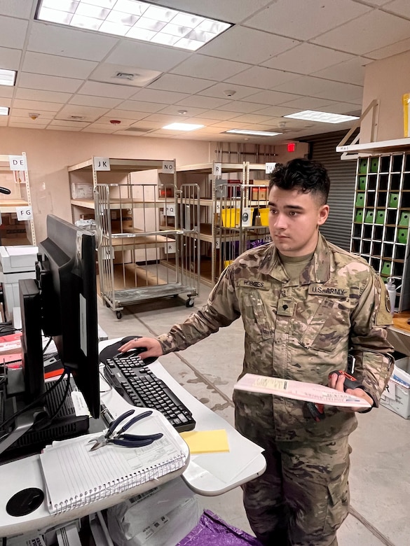 Spc. Kristian Hodges, a postal specialist with the 909th HR Co. (Postal), inputs data from a package into the mail room computer system at the Soto Cano Post Office on Soto Cano Air Base near Comayagua, Honduras. The unit just kicked off a 9-month deployment providing postal operations at the air base.