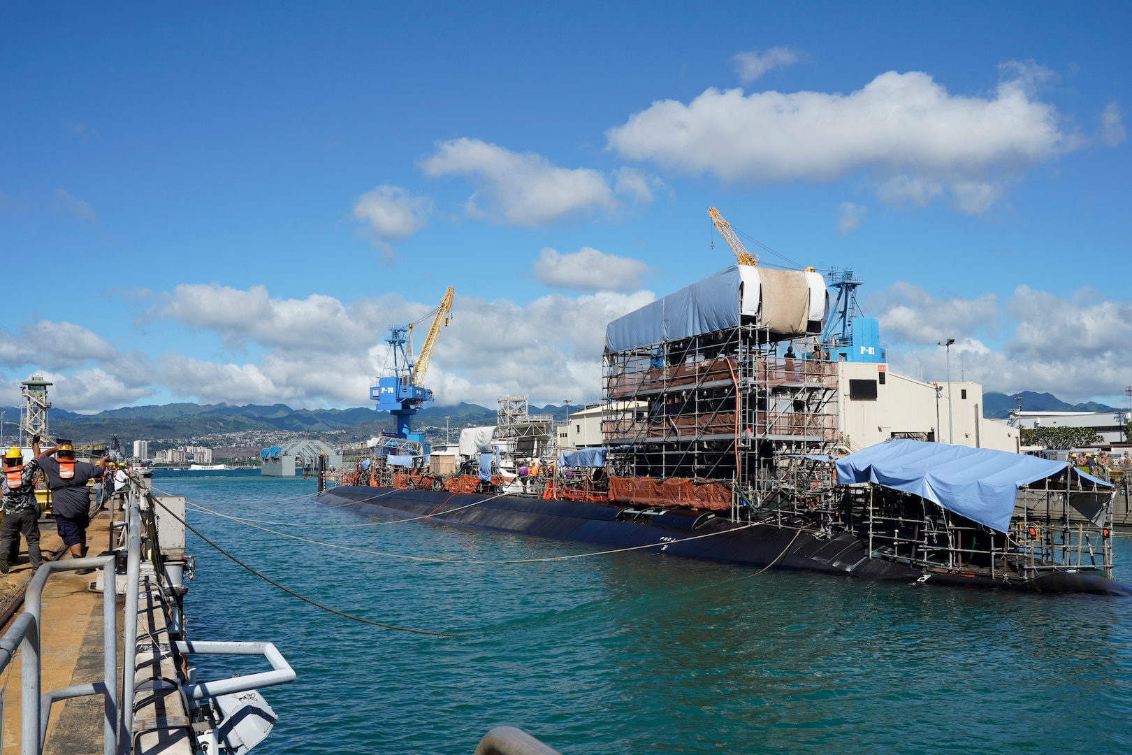 Pearl Harbor Naval Shipyard & Intermediate Maintenance Facility personnel assist in the undocking of the Virginia-class attack submarine USS Minnesota (SSN 783) from Dry Dock 2, Oct. 12, 2023.