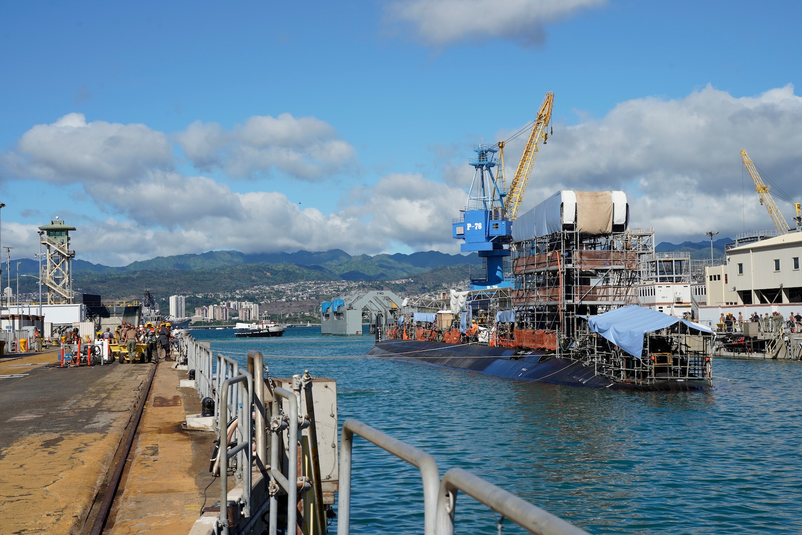 Pearl Harbor Naval Shipyard & Intermediate Maintenance Facility personnel assist in the undocking of the Virginia-class attack submarine USS Minnesota (SSN 783) from Dry Dock 2, Oct. 12, 2023.