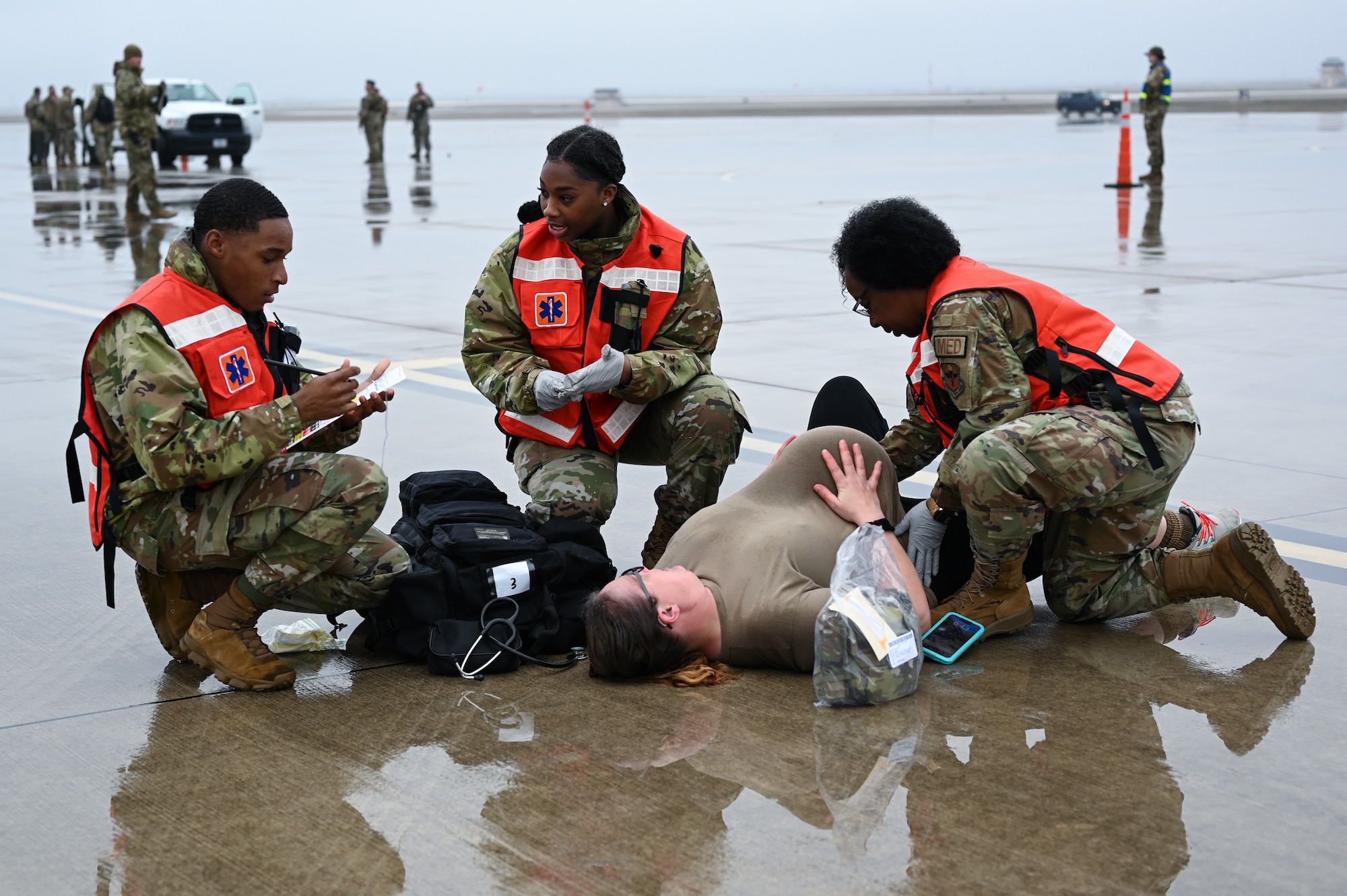 U.S. Air Force Airmen from the 47th Medical Group treat a simulated pregnant woman during a Major Accident Response Exercise (MARE) on the flight line at Laughlin Air Force Base, Texas, Dec. 14, 2023