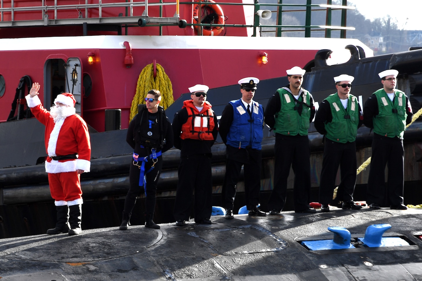Santa waves on board USS Colorado (SSN 788) as the ship prepares to moor during a homecoming event in Groton, Conn., Dec. 19.