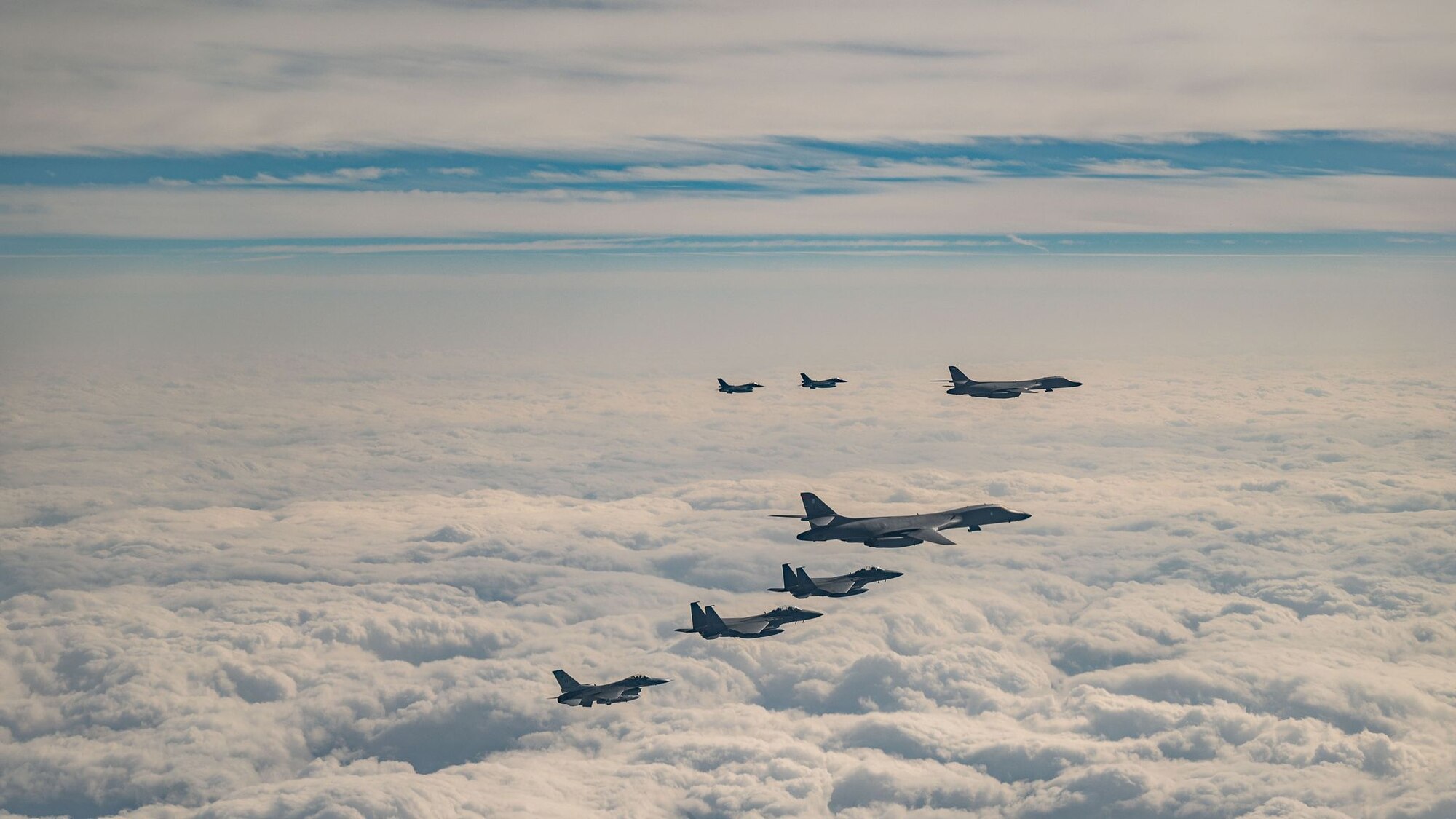For the second time this year, fighter aircraft from the U.S., Japan, and the Republic of Korea conducted a trilateral escort flight of U.S. bombers operating in the Indo-Pacific, Dec. 20, 2023. U.S. F-16s from the 80th Fighter Squadron, 8th Fighter Wing and 14th Fighter Squadron, 35th Fighter Wing flew alongside Japan Air Self-Defense Force (JASDF) F-2s from the 8th Air Wing, and Republic of Korea Air Force (ROKAF) F-15Ks from the 11th Wing, escorting two U.S. Air Force B-1B Lancers. The continued high-end interoperability of our collective forces demonstrates the strength of the trilateral relationship with our Japan and Republic of Korea allies. Our international cooperation is reflective of our shared values and resolve against those who challenge regional stability. We remain committed to peace and prosperity in the region to uphold a free and open Indo-Pacific.