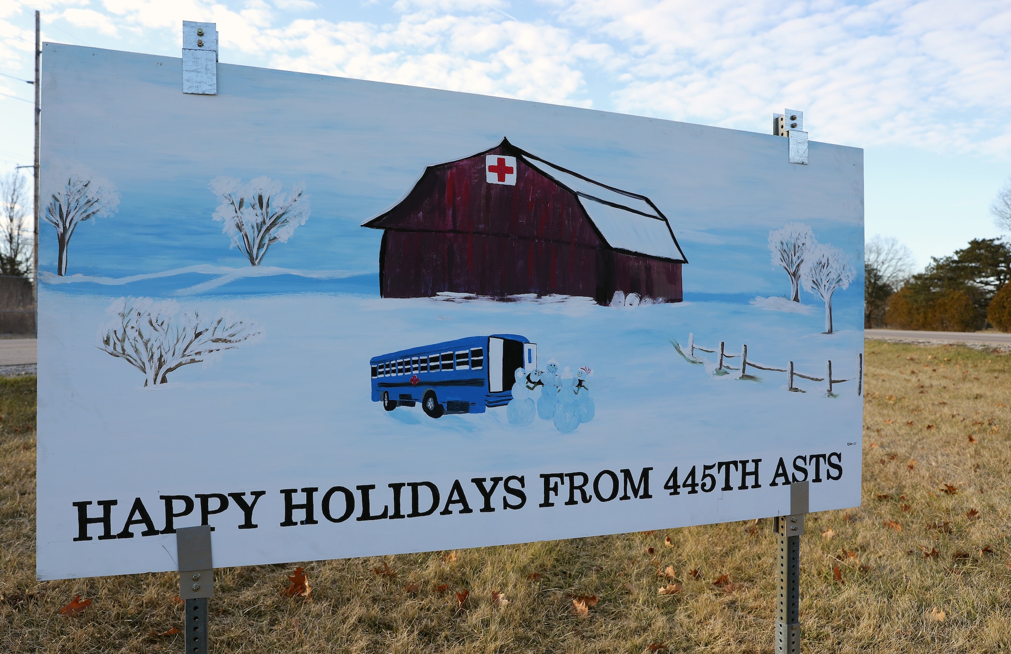 The 445th Aeromedical Staging Squadron celebrates the holidays with a six-foot greeting card for the base card display. Various units participated with cards that represent their mission. (U.S. Air Force photo by Amanda Dick)