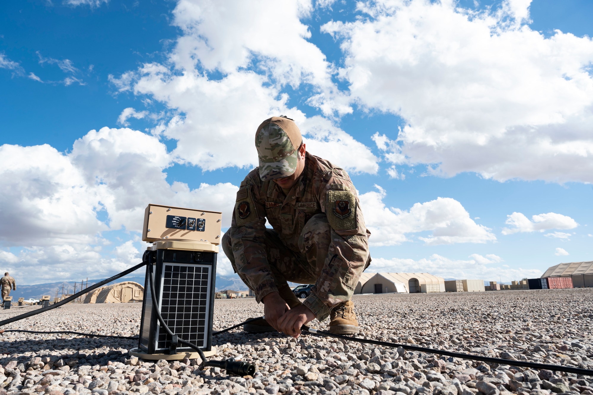 U.S. Air Force Staff Sgt. Daniel Santiago, 1st Special Operations Civil Engineer Squadron electrician, lays out a group of Expeditionary Aircraft Lighting System lights during a training course at Holloman Air Force Base, New Mexico, Dec. 14, 2023. The new EALS model enhances the Air Force’s rapid response in urgent missions, ensuring swift airfield setup in critical scenarios. (U.S. Air Force photo by Airman 1st Class Isaiah Pedrazzini)