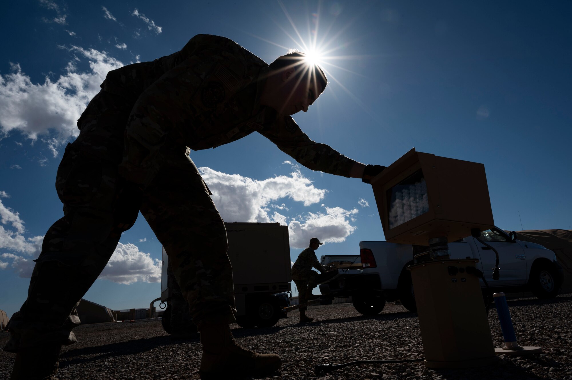 U.S. Air Force Staff Sgt. Charles Williams, 419th Civil Engineer Squadron electrician, prepares to take down a light for an Expeditionary Aircraft Lighting System layout during a training course at Holloman Air Force Base, New Mexico, Dec. 14, 2023.With the upgraded EALS, the Air Force has the capability to efficiently provide temporary landing areas for aircraft in deployed environments. (U.S. Air Force photo by Airman 1st Class Isaiah Pedrazzini)