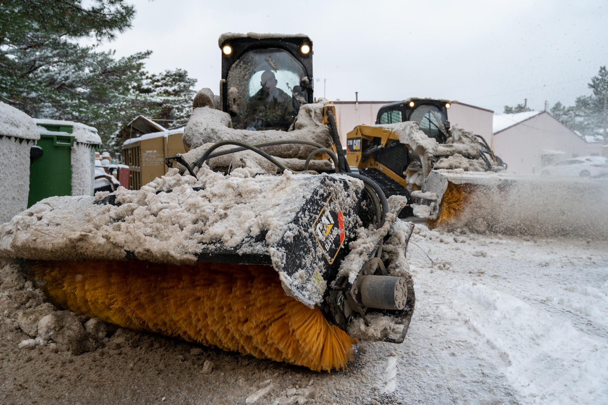 Airmen clear snow and ice from Kunsan Air Base