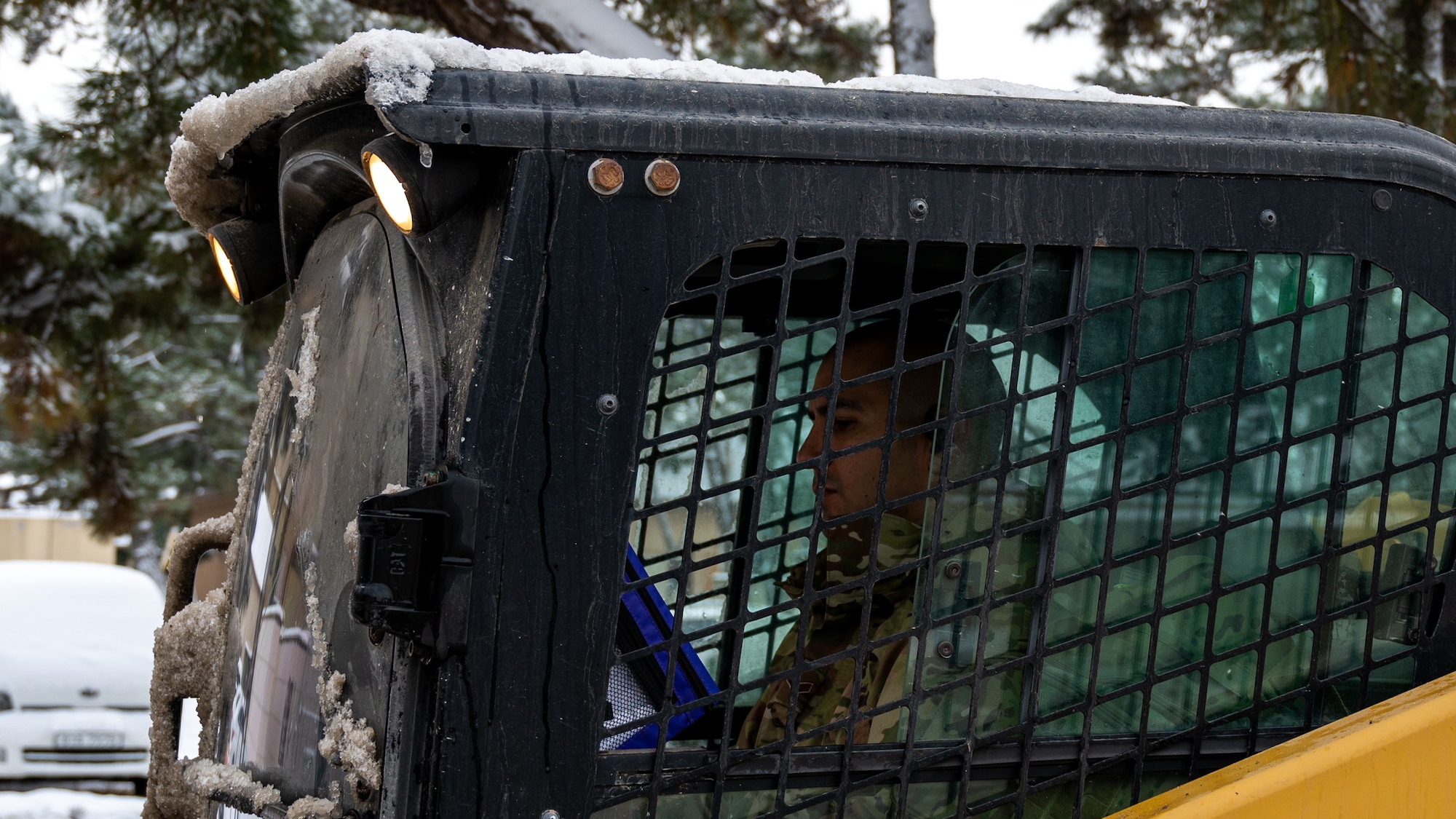Airmen clear snow and ice from Kunsan Air Base