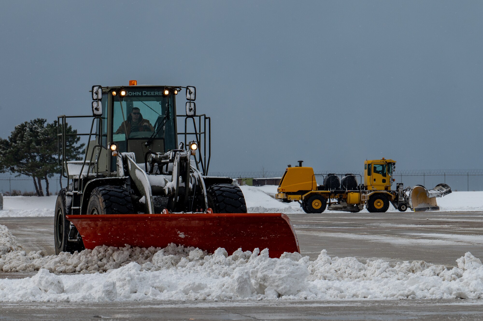 Airmen clear snow and ice from Kunsan Air Base