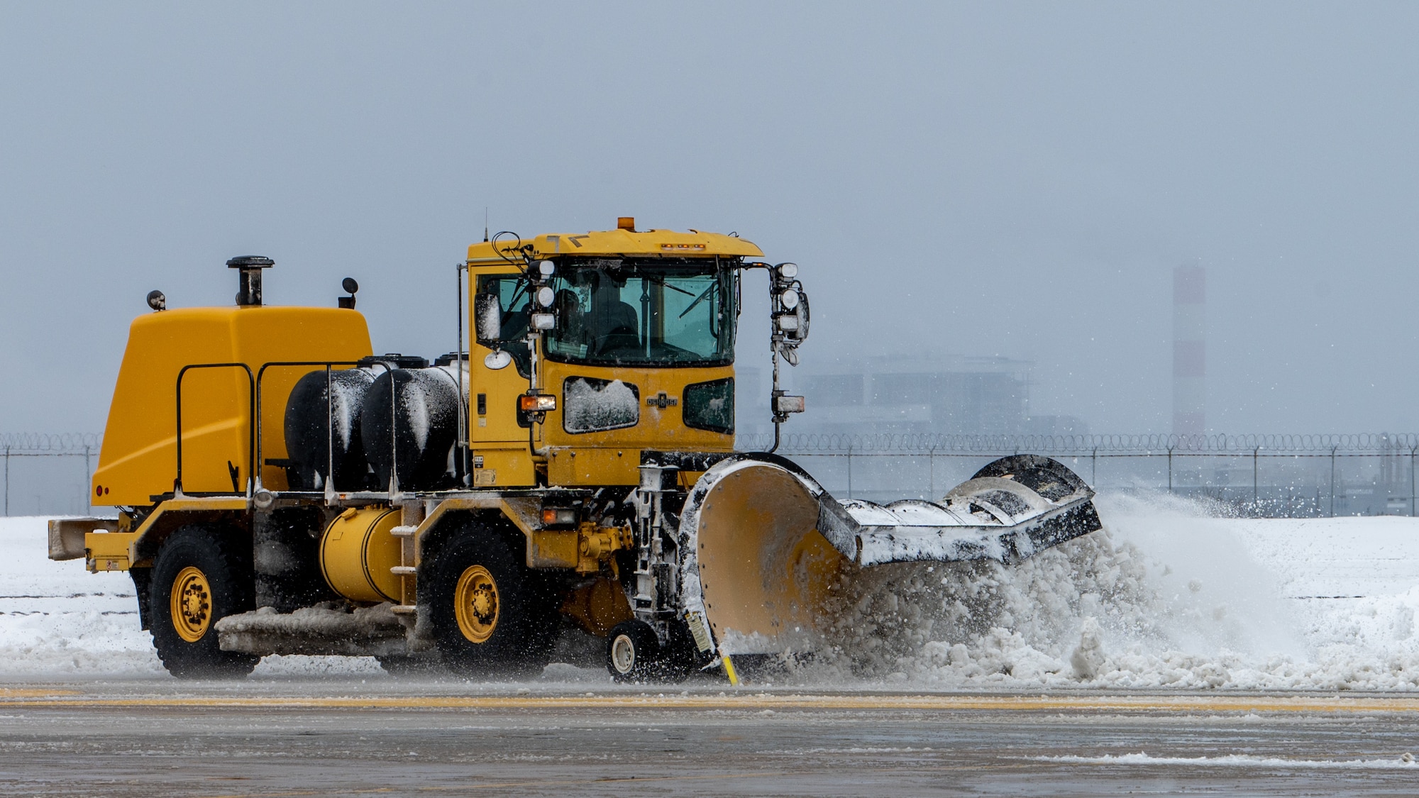 Airmen clear snow and ice from Kunsan Air Base