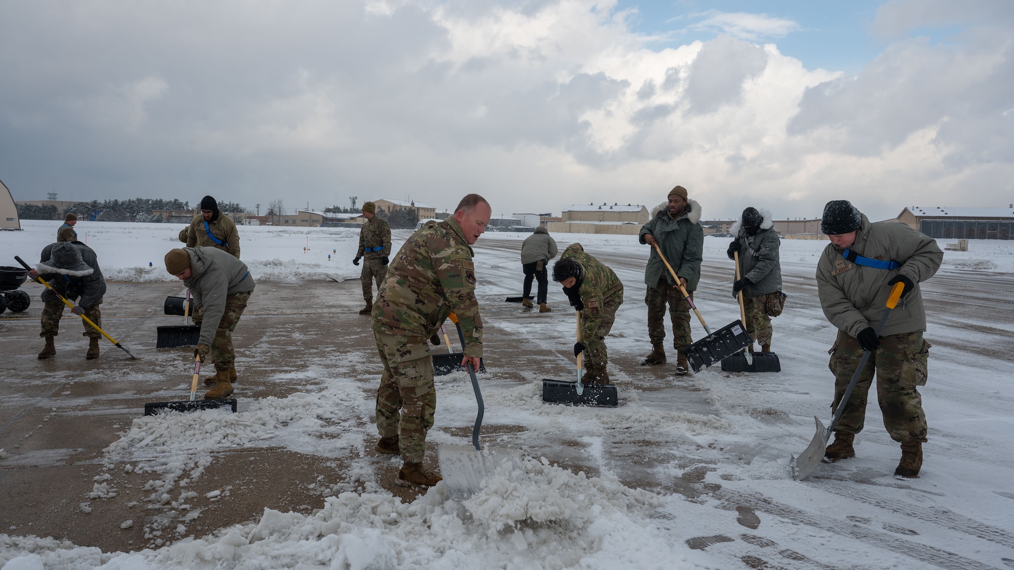 Airmen clear snow and ice from Kunsan Air Base