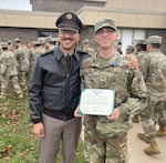 U.S. Army Pvt. Anthony Del Tufo, Recruiting and Retention Battalion, New Jersey Army National Guard, receives a state award from the Nutley Board of Education at Nutley High School in Nutley, New Jersey, Dec. 11, 2023, for helping residents of a home threatened by a fire.