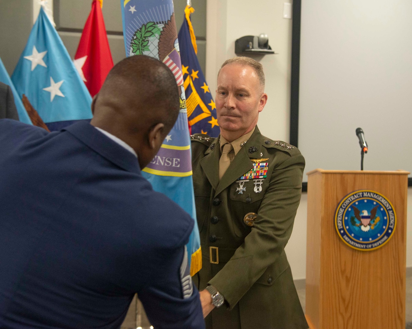 Lieutenant General Gregory Masiello receives Defense Contract Management Agency's organizational colors.