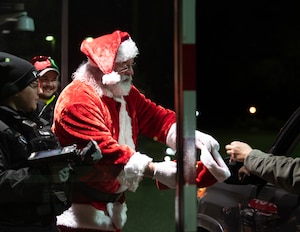 Joe Hormann, 133rd Civil Engineer Squadron, dresses up as Santa Claus in St. Paul, Minn., Dec. 20, 2023.