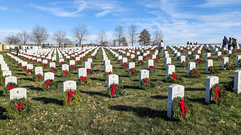 Volunteers placed wreaths in front of headstones at the National Cemetery of the Alleghenies as part of Wreathes Across America, Bridgeville, Pennsylvania Dec. 16, 2023. (U.S. Air National Guard photo by Tech. Sgt. Michael Fariss)